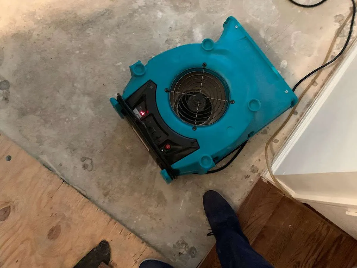 Air mover drying subfloor during Leak Detection & Repair in Brigham City